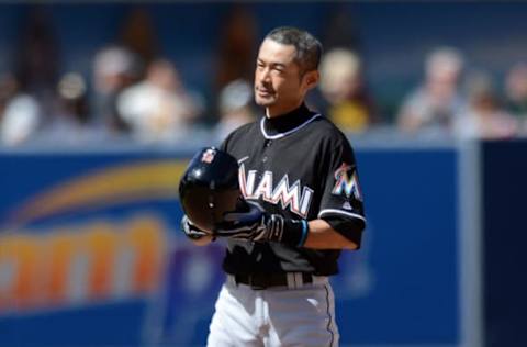 Jun 15, 2016; San Diego, CA, USA; Miami Marlins center fielder Ichiro Suzuki (51) tips his helmet after hitting his 4257th professional hit with a double against the San Diego Padres during the ninth inning at Petco Park. Mandatory Credit: Jake Roth-USA TODAY Sports