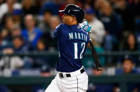 Sep 29, 2016; Seattle, WA, USA; Seattle Mariners center fielder Leonys Martin (12) hits an RBI-single against the Oakland Athletics during the fourth inning at Safeco Field. Mandatory Credit: Joe Nicholson-USA TODAY Sports