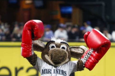 Sep 30, 2016; Seattle, WA, USA; Seattle Mariners mascot Moose walks on the field with boxing gloves before the first inning against the Oakland Athletics at Safeco Field. Mandatory Credit: Joe Nicholson-USA TODAY Sports