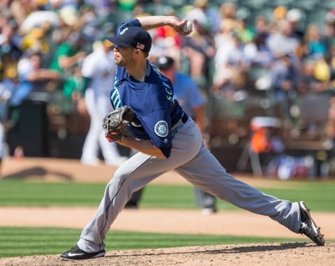 Sep 11, 2016; Oakland, CA, USA; Seattle Mariners relief pitcher Evan Scribner (58) pitches the ball against the Oakland Athletics during the seventh inning at Oakland Coliseum. Mandatory Credit: Kelley L Cox-USA TODAY Sports