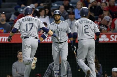 April 8, 2017; Anaheim, CA, USA; Seattle Mariners center fielder Mitch Haniger (17) is greeted by second baseman Robinson Cano (22) and shortstop Jean Segura (2) after hitting a two-run home run in the first inning against the Los Angeles Angels at Angel Stadium of Anaheim. Mandatory Credit: Gary A. Vasquez-USA TODAY Sports