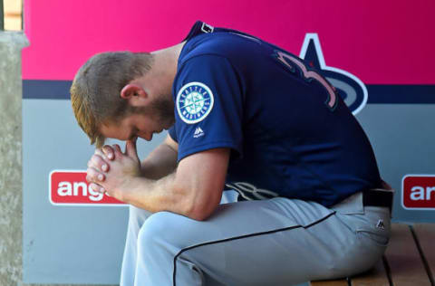 Apr 9, 2017; Anaheim, CA, USA; Seattle Mariners relief pitcher Casey Fien (38) sits in an empty dugout after the game against the Los Angeles Angels at Angel Stadium of Anaheim. Fein gave up a home run to Los Angeles Angels designated hitter Albert Pujols (5), a single and walked two batters in the ninth inning. Angels won 10-9. Mandatory Credit: Jayne Kamin-Oncea-USA TODAY Sports