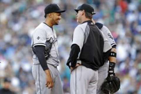 Aug 9, 2014; Seattle, WA, USA; Chicago White Sox bullpen coach Bobby Thigpen (58) speaks with pitcher Hector Noesi (48) during the fourth inning against the Seattle Mariners at Safeco Field. Mandatory Credit: Joe Nicholson-USA TODAY Sports