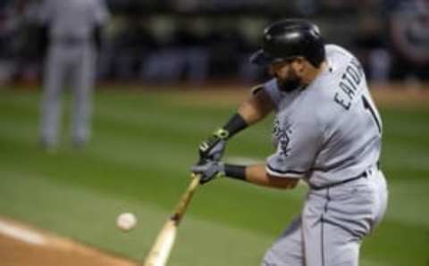 Apr 5, 2016; Oakland, CA, USA; Chicago White Sox right fielder Adam Eaton (1) hits a single against the Oakland Athletics during the third inning at the Oakland Coliseum. Mandatory Credit: Kelley L Cox-USA TODAY Sports