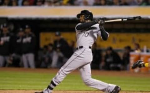 Apr 5, 2016; Oakland, CA, USA; Chicago White Sox center fielder Austin Jackson (10) hits an RBI single against the Oakland Athletics during the sixth inning at the Oakland Coliseum. Mandatory Credit: Kelley L Cox-USA TODAY Sports