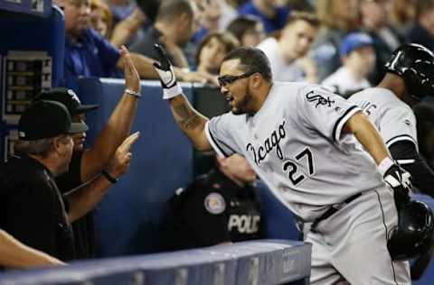 Apr 27, 2016; Toronto, Ontario, CAN; Chicago White Sox catcher Dioner Navarro (27) is congratulated after scoring on a triple by center fielder Austin Jackson (not pictured) in the seventh inning against the Toronto Blue Jays at Rogers Centre. Mandatory Credit: John E. Sokolowski-USA TODAY Sports