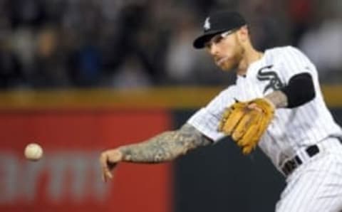 May 6, 2016; Chicago, IL, USA; Chicago White Sox second baseman Brett Lawrie (15) throws after fielding a ground ball hit by Minnesota Twins center fielder Danny Santana (not pictured) to end the ninth inning at U.S. Cellular Field. The White Sox won 10-4. Mandatory Credit: Patrick Gorski-USA TODAY Sports