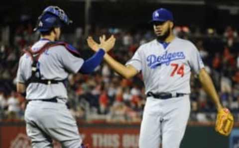 Jul 19, 2016; Washington, DC, USA; Los Angeles Dodgers relief pitcher Kenley Jansen (74) is congratulated by catcher Yasmani Grandal (9) after recording the final out against the Washington Nationals at Nationals Park. Mandatory Credit: Brad Mills-USA TODAY Sports