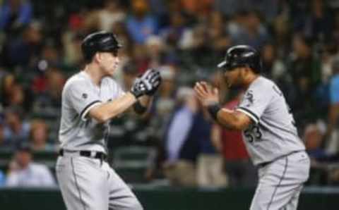 Jul 19, 2016; Seattle, WA, USA; Chicago White Sox third baseman Todd Frazier (21) celebrates his two-run home run against the Seattle Mariners with left fielder Melky Cabrera (53) during the ninth inning at Safeco Field. Cabrera scored a run on the hit. Chicago defeated Seattle, 6-1. Mandatory Credit: Joe Nicholson-USA TODAY Sports