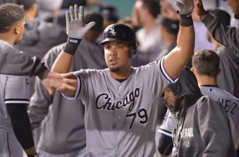 Sep 16, 2014; Kansas City, MO, USA; Chicago White Sox first baseman Jose Abreu (79) is congratulated by team mates in the dugout after scoring in the seventh inning against the Kansas City Royals at Kauffman Stadium. Mandatory Credit: Denny Medley-USA TODAY Sports