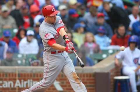 Jun 12, 2015; Chicago, IL, USA; Cincinnati Reds third baseman Todd Frazier (21) hits a home run during the third inning against the Chicago Cubs at Wrigley Field. Mandatory Credit: Caylor Arnold-USA TODAY Sports