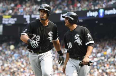 Aug 23, 2015; Seattle, WA, USA; Chicago White Sox third baseman Tyler Saladino (18) talks with designated hitter Jose Abreu (79) after both of them scored on a 2-run home run by Abreu in the sixth inning against the Seattle Mariners at Safeco Field. Mandatory Credit: Jennifer Buchanan-USA TODAY Sports