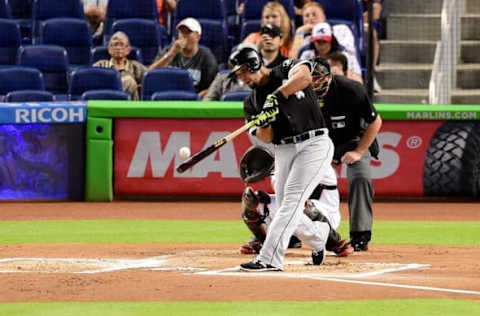 Aug 12, 2016; Miami, FL, USA; Chicago White Sox first baseman Jose Abreu (79) connects for an RBI single during the first inning against the Miami Marlins at Marlins Park. Mandatory Credit: Steve Mitchell-USA TODAY Sports