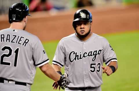 Aug 14, 2016; Miami, FL, USA; Chicago White Sox third baseman Todd Frazier (left) greets White Sox left fielder Melky Cabrera (right) after Cabrera scored a run during the first inning against the Miami Marlins at Marlins Park. Mandatory Credit: Steve Mitchell-USA TODAY Sports