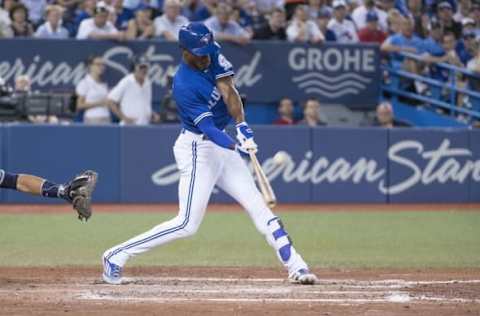 Aug 9, 2016; Toronto, Ontario, CAN; Toronto Blue Jays left fielder Melvin Upton Jr. (7) hits an RBI sacrifice fly ball during the fifth inning in a game against the Tampa Bay Rayss at Rogers Centre. Mandatory Credit: Nick Turchiaro-USA TODAY Sports