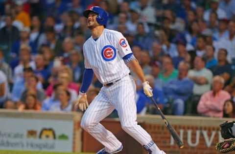 Aug 8, 2015; Chicago, IL, USA; Chicago Cubs third baseman Kris Bryant (17) hits a home run during the first inning against the Pittsburgh Pirates at Wrigley Field. Mandatory Credit: Dennis Wierzbicki-USA TODAY Sports