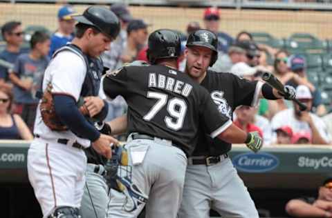 Sep 4, 2016; Minneapolis, MN, USA; Chicago White Sox first baseman Jose Abreu (79) celebrates with third baseman Todd Frazier (21) after hitting a three run home run during the first inning against the Minnesota Twins at Target Field. Mandatory Credit: Jordan Johnson-USA TODAY Sports