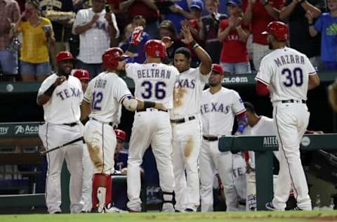 Sep 21, 2016; Arlington, TX, USA; Texas Rangers right fielder Carlos Beltran (36) celebrates with teammates after hitting a two run home run during the fifth inning against the Los Angeles Angels at Globe Life Park in Arlington. Mandatory Credit: Kevin Jairaj-USA TODAY Sports