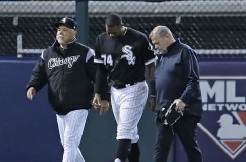 CHICAGO, ILLINOIS – APRIL 26: Manager Rick Renteria of the Chicago White Sox (L) escorts Eloy Jimenez #74 off the field after Jimenez hit the wall trying to catch a home run ball against the Detroit Tigers at Guaranteed Rate Field on April 26, 2019 in Chicago, Illinois. (Photo by Jonathan Daniel/Getty Images)