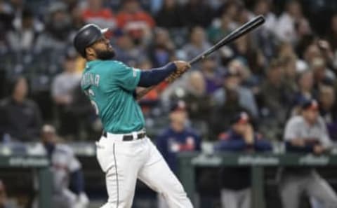 SEATTLE, WA – JUNE 5: Domingo Santana #16 of the Seattle Mariners hits a two-run home run off of relief pitcher Reymin Guduan #64 of the Houston Astros during the sixth inning of a game at T-Mobile Park on June 5, 2019, in Seattle, Washington. (Photo by Stephen Brashear/Getty Images)