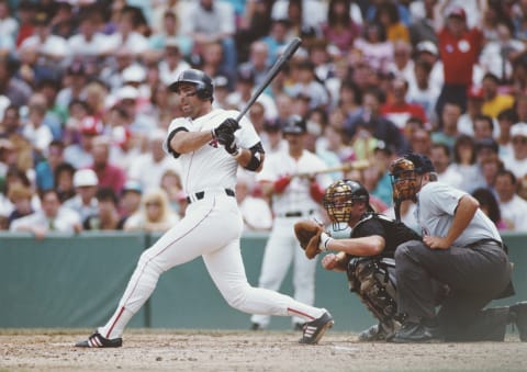 Jack Clark, Designated Hitter for the Boston Red Sox swings at the pitch as White Sox catcher Carlton Fisk and Home Plate umpire John Shulock await during the Major League Baseball American League East game on 27 July 1991 at Fenway Park in Boston, Massachusetts, United States. The Red Sox won the game 7 – 3. (Photo by Jim Commentucci/Allsport/Getty Images)