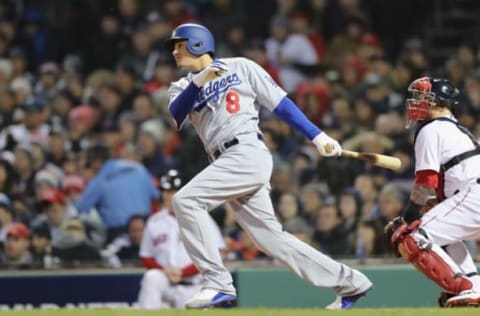 BOSTON, MA – OCTOBER 24: Manny Machado #8 of the Los Angeles Dodgers singles during the fourth inning against the Boston Red Sox in Game Two of the 2018 World Series at Fenway Park on October 24, 2018 in Boston, Massachusetts. (Photo by Elsa/Getty Images)