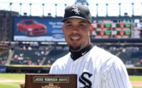 CHICAGO, IL – APRIL 26: Jose Abreu #79 of the Chicago White Sox holds the 2014 rookie of the year award before the game against the Kansas City Royals on April 26, 2015 at U. S. Cellular Field in Chicago, Illinois.The game was a continuation of a suspended game from April 24, 2015. (Photo by David Banks/Getty Images)