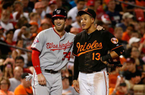 BALTIMORE, MD – JULY 10: Bryce Harper #34 of the Washington Nationals and Manny Machado #13 of the Baltimore Orioles talk during their game at Oriole Park at Camden Yards on July 10, 2015 in Baltimore, Maryland. (Photo by Rob Carr/Getty Images)