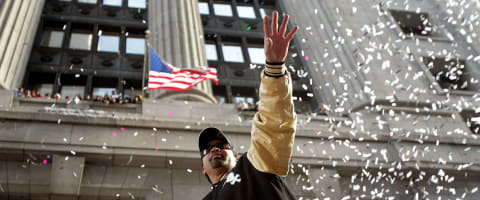 CHICAGO – OCTOBER 28: Chicago White Sox manager Ozzie Guillen waves to fans from a double-decker bus during a ticker-tape parade for the White Sox baseball team October 28, 2005 in downtown Chicago, Illinois. The Chicago White Sox won their first World Series in 88 years after beating the Houston Astros in a four-game sweep. (Photo by Tim Boyle/Getty Images)