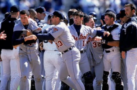 20 Apr 2000: Matt Anderson #14 of Detroit Tigers is held back from fighting by teammates Lance Parrish #13 and Catcher Brad Ausmus #12 during the game against the Chicago White Sox at Comiskey Park in Chicago, Illinois. The White Sox defeated the Tigers 14-6.