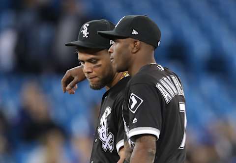 TORONTO, ON – APRIL 3: Tim Anderson #7 of the Chicago White Sox puts his arm around Yoan Moncada #10 during a pitching change in the eighth inning during MLB game action against the Toronto Blue Jays at Rogers Centre on April 3, 2018 in Toronto, Canada. (Photo by Tom Szczerbowski/Getty Images)