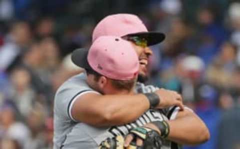 CHICAGO, IL – MAY 13: Jose Abreu #79 of the Chicago White Sox hugs teammate Matt Davidson #24 after a win against the Chicago Cubs at Wrigley Field on May 13, 2018 in Chicago, Illinois. The White Sox defeated the Cubs 5-3. (Photo by Jonathan Daniel/Getty Images)