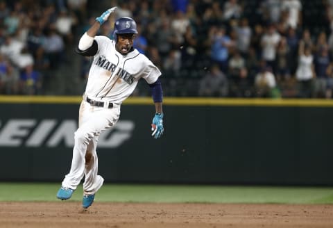 SEATTLE, WA – JULY 05: Dee Gordon #9 of the Seattle Mariners holds on to his batting helmet as he heads for third base on a triple in the seventh inning against the Los Angeles Angels of Anaheim at Safeco Field on July 5, 2018 in Seattle, Washington. (Photo by Lindsey Wasson/Getty Images)