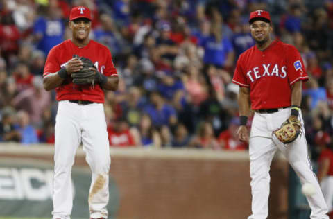 Sep 30, 2016; Arlington, TX, USA; Texas Rangers third baseman Adrian Beltre (29) and shortstop Elvis Andrus (1) smile while warming up before the sixth inning against the Tampa Bay Rays at Globe Life Park in Arlington. Mandatory Credit: Tim Heitman-USA TODAY Sports