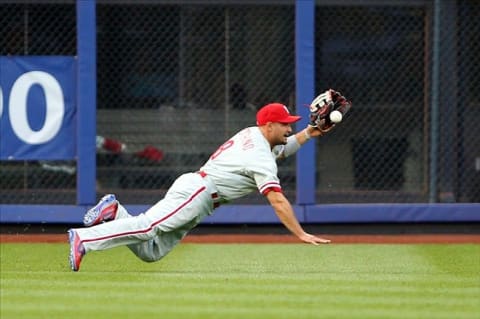 May 29, 2012; Flushing, NY,USA; Philadelphia Phillies center fielder Shane Victorino (8) dives for the hit from New York Mets center fielder Kirk Nieuwenhuis (not pictured) during the first inning at Citi Field. Mandatory Credit: Anthony Gruppuso-US PRESSWIRE