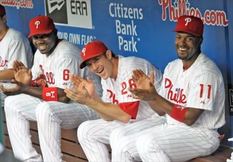 August 10, 2012; Philadelphia, PA USA; Philadelphia Phillies first baseman Ryan Howard (6), second baseman Chase Utley (26) and shortstop Jimmy Rollins (11) applaud former Phillies teammate Mike Lieberthal (not pictured) who was inducted into the Phillies