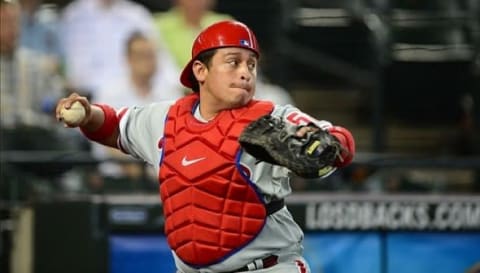 Apr. 25, 2012; Phoenix, AZ, USA; Philadelphia Phillies catcher Carlos Ruiz makes a throw against the Arizona Diamondbacks at Chase Field. Mandatory Credit: Mark J. Rebilas-USA TODAY Sports