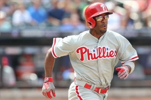 Jul 21, 2013; New York, NY, USA; Philadelphia Phillies shortstop Jimmy Rollins (11) grounds out during the sixth inning against the New York Mets at Citi Field. Mandatory Credit: Anthony Gruppuso-USA TODAY Sports