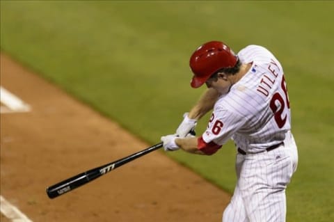 Sep 10, 2013; Philadelphia, PA, USA; Philadelphia Phillies second baseman Chase Utley (26) doubles during the fourth inning against the San Diego Padres at Citizens Bank Park. The Padres defeated the Phillies 8-2. Mandatory Credit: Howard Smith-USA TODAY Sports