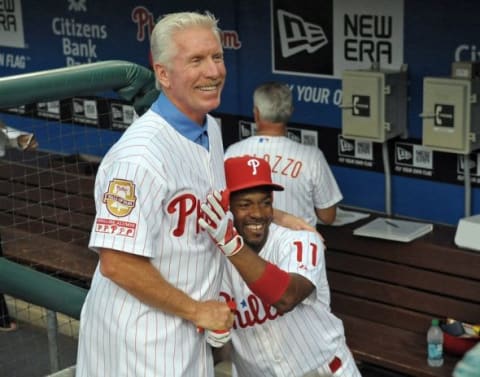 August 10, 2012; Philadelphia, PA USA; Philadelphia Phillies hall of fame third baseman Mike Schmidt jokes with Philadelphia Phillies shortstop Jimmy Rollins (11) during pre-game ceremony before game against the St. Louis Cardinals at Citizens Bank Park. Mandatory Credit: Eric Hartline-USA TODAY Sports