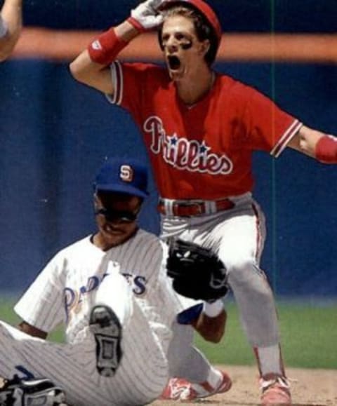 Mickey Morandini shows off red jersey worn in San Diego in 1992.