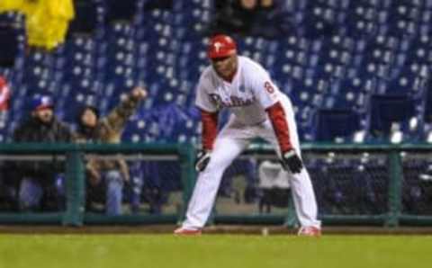 Apr 29, 2014; Philadelphia, PA, USA; Philadelphia Phillies first base coach Juan Samuel (8) during the eighth inning of the game against the New York Mets at Citizens Bank Park. The New York Mets won the game 6-1. Mandatory Credit: John Geliebter-USA TODAY Sports