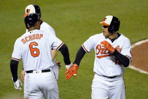 Apr 28, 2016; Baltimore, MD, USA; Baltimore Orioles third baseman Machado (13) celebrates with second baseman Schoop (6) after hitting a grand slam during the sixth inning against the Chicago White Sox at Oriole Park at Camden Yards. Baltimore Orioles defeated Chicago White Sox 10-2. (Photo Credit: Tommy Gilligan-USA TODAY Sports)