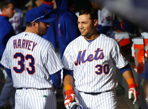 Apr 30, 2016; New York City, NY, USA; New York Mets starting pitcher Harvey (33) talks to New York Mets left fielder Conforto (30) after his homer in the fifth inning against the San Francisco Giants at Citi Field. (Photo Credit: Noah K. Murray-USA TODAY Sports)