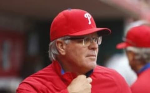 Apr 4, 2016; Cincinnati, OH, USA; Philadelphia Phillies manager Mackanin watches from the dugout during the seventh inning against the Cincinnati Reds at Great American Ball Park. Mandatory Credit: David Kohl-USA TODAY Sports