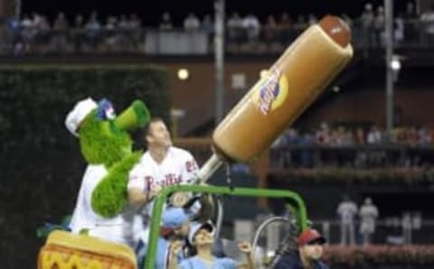 Aug 9, 2014; Philadelphia, PA, USA; Philadelphia Phillies former player Jim Thome and the Phillie Phanatic shoot hot dogs into the crowd in between innings of game against the New York Mets at Citizens Bank Park. The Mets defeated the Phillies, 2-1 in 11 innings. Mandatory Credit: Eric Hartline-USA TODAY Sports