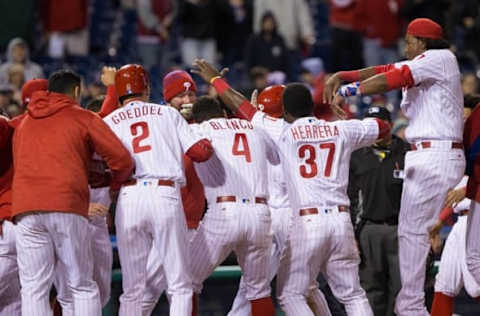 Apr 29, 2016; Philadelphia, PA, USA; Philadelphia Phillies first baseman Ryan Howard (6) is mobbed by his team after hitting a game winning home run during the eleventh inning against the Cleveland Indians at Citizens Bank Park. The Philadelphia Phillies won 4-3. Mandatory Credit: Bill Streicher-USA TODAY Sports