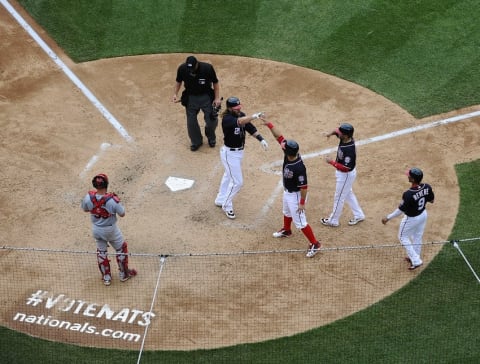 May 29, 2016; Washington, DC, USA; Washington Nationals left fielder Jayson Werth (28) is congratulated by left fielder Ben Revere (9) and shortstop Danny Espinosa (8) and catcher Wilson Ramos (40) after hitting a grand slam against the St. Louis Cardinals during the seventh inning at Nationals Park. Mandatory Credit: Brad Mills-USA TODAY Sports