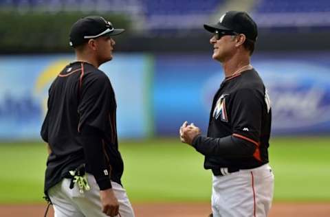 May 11, 2016; Miami, FL, USA; Miami Marlins manager Don Mattingly (right) talks with Marlins second baseman Miguel Rojas (left) prior to a game against the Milwaukee Brewers at Marlins Park. Mandatory Credit: Steve Mitchell-USA TODAY Sports