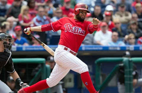 May 18, 2016; Philadelphia, PA, USA; Philadelphia Phillies second baseman Andres Blanco (4) hits an RBI double during the third inning against the Miami Marlins at Citizens Bank Park. Mandatory Credit: Bill Streicher-USA TODAY Sports